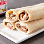 لفائف ربيع حلوة بحشوة نوتيلا وموز، تناغم حلو لا يقاوم، لقطة شهية ومقرمشة.