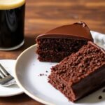 Guinness-free cake featuring ultra-moist chocolate stout cake in a one-bowl slice, glossy crumb.