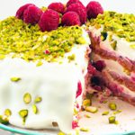 Decadent Pistachio Raspberry Cake with White Chocolate Frosting