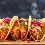 Korean fried chicken tacos with spicy kimchi slaw.