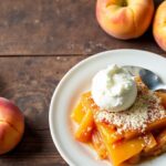 Easy peach cobbler with cake mix topping, delicious dessert.