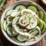 Creamy cucumber and onion salad recipe, fresh and delicious.