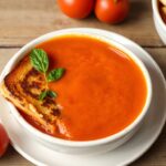 Delicious classic grilled cheese and tomato soup, comfort food perfection.