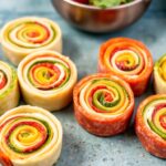 Colorful rainbow veggie pinwheels with cream cheese recipe.