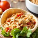 Tender slow cooker pulled chicken, perfect for salads.