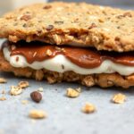 Sweet oatmeal cookie ice cream sandwich: chewy delight.