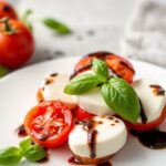 Fresh Caprese salad with cherry tomatoes and balsamic glaze.
