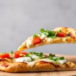 Gourmet taco pizza with goat cheese and cilantro-lime.