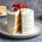 Unveiling magic: Decadent cannoli cake, a sweet, creamy delight.