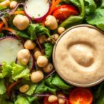 Steamed veggie salad with creamy peanut sauce delight.