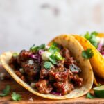 Savor rich birria tacos: tender braised beef, flavorful comfort.