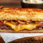 Savor classic patty melt on toasted rye bread.