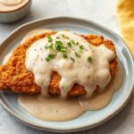 Delicious chicken fried steak with creamy gravy, Southern comfort food.